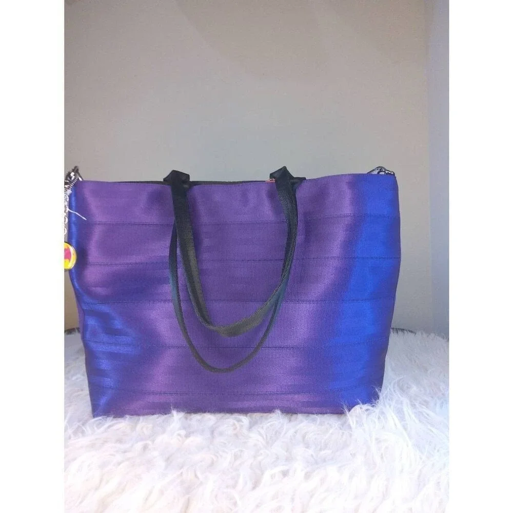 Harveys Disney Parks Pixar Seatbelt Tote Bag Purple Multi Toy Story Monsters Inc